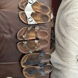 3 pairs of Birkenstock sandals.